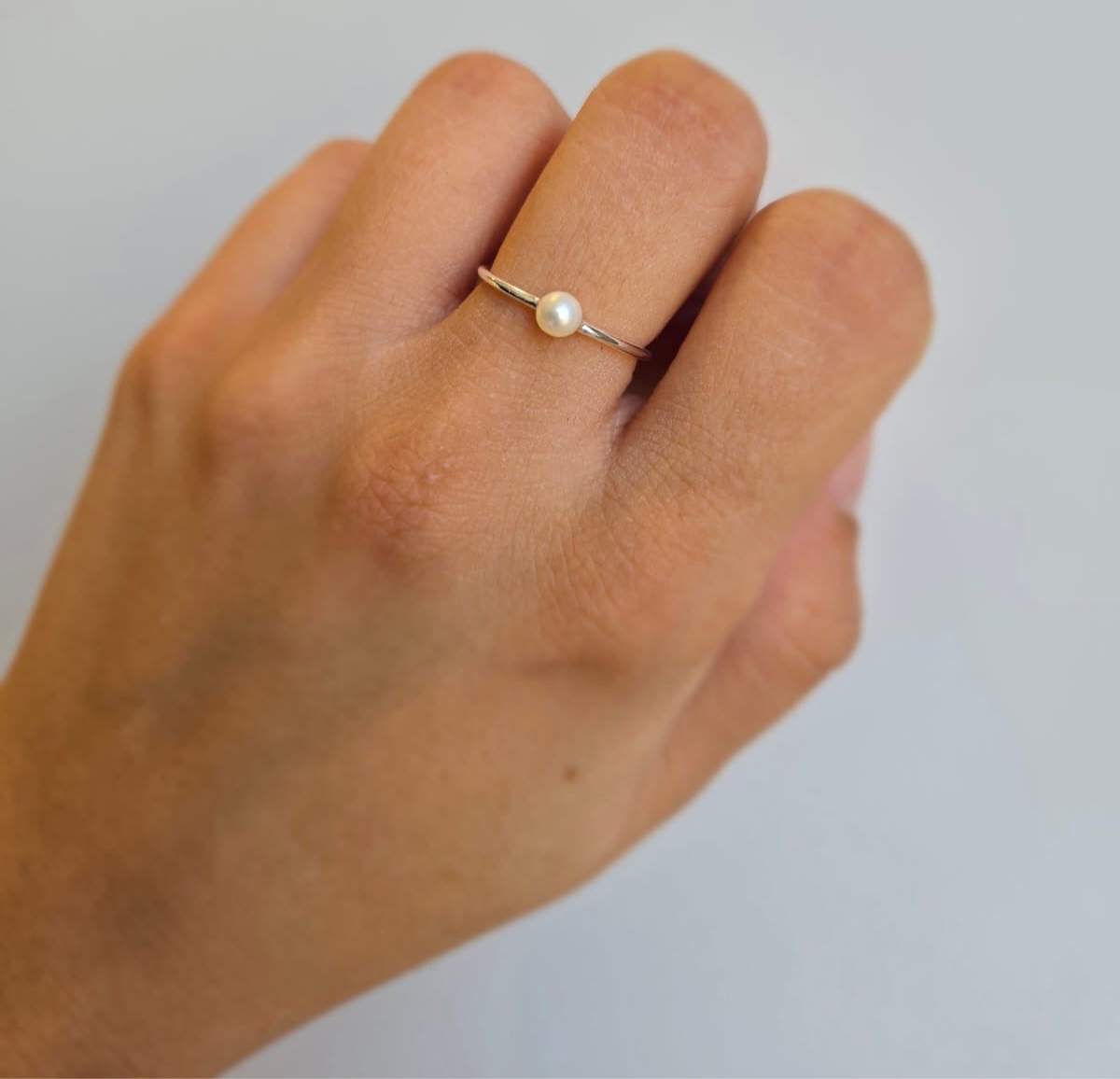 Adjustable sterling silver ring with tiny freshwater pearl
