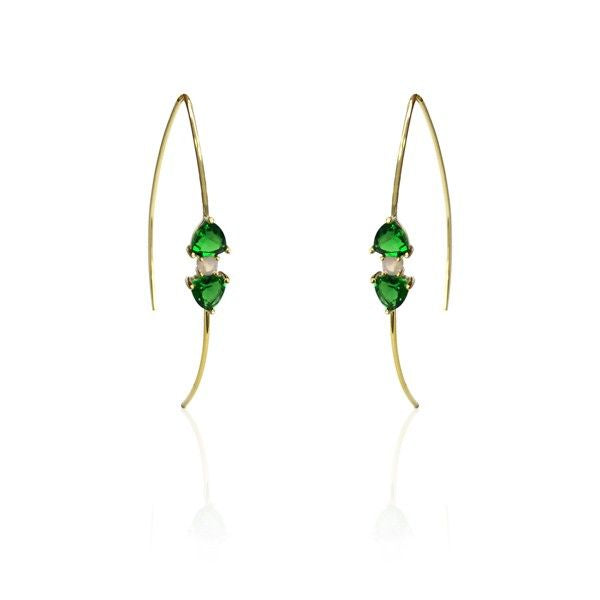 Gold earrings with green gemstones on a white background