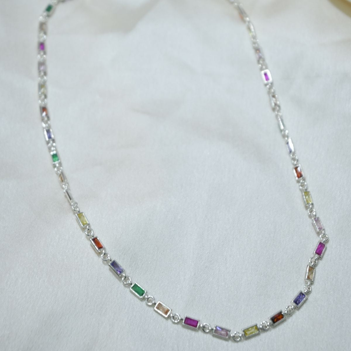 Necklace with multicolored beads on a white background
