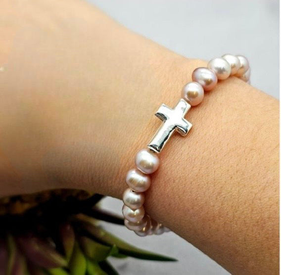 7 blush freshwater pearls on elastic band with sterling silver cross