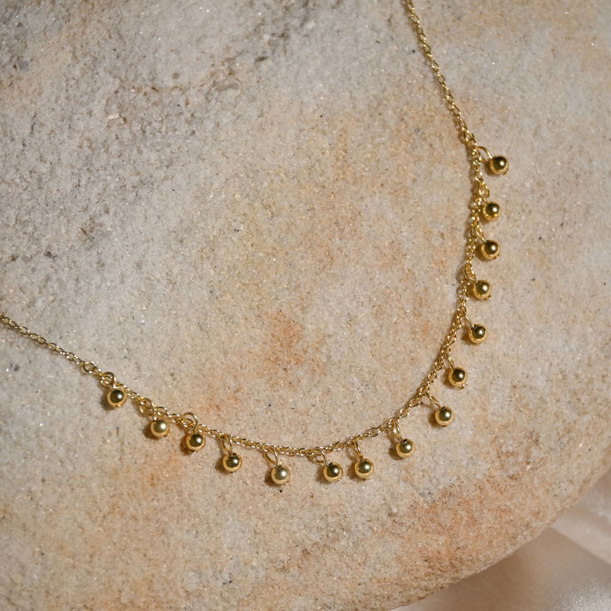 Lots of tiny little balls on chain necklace
