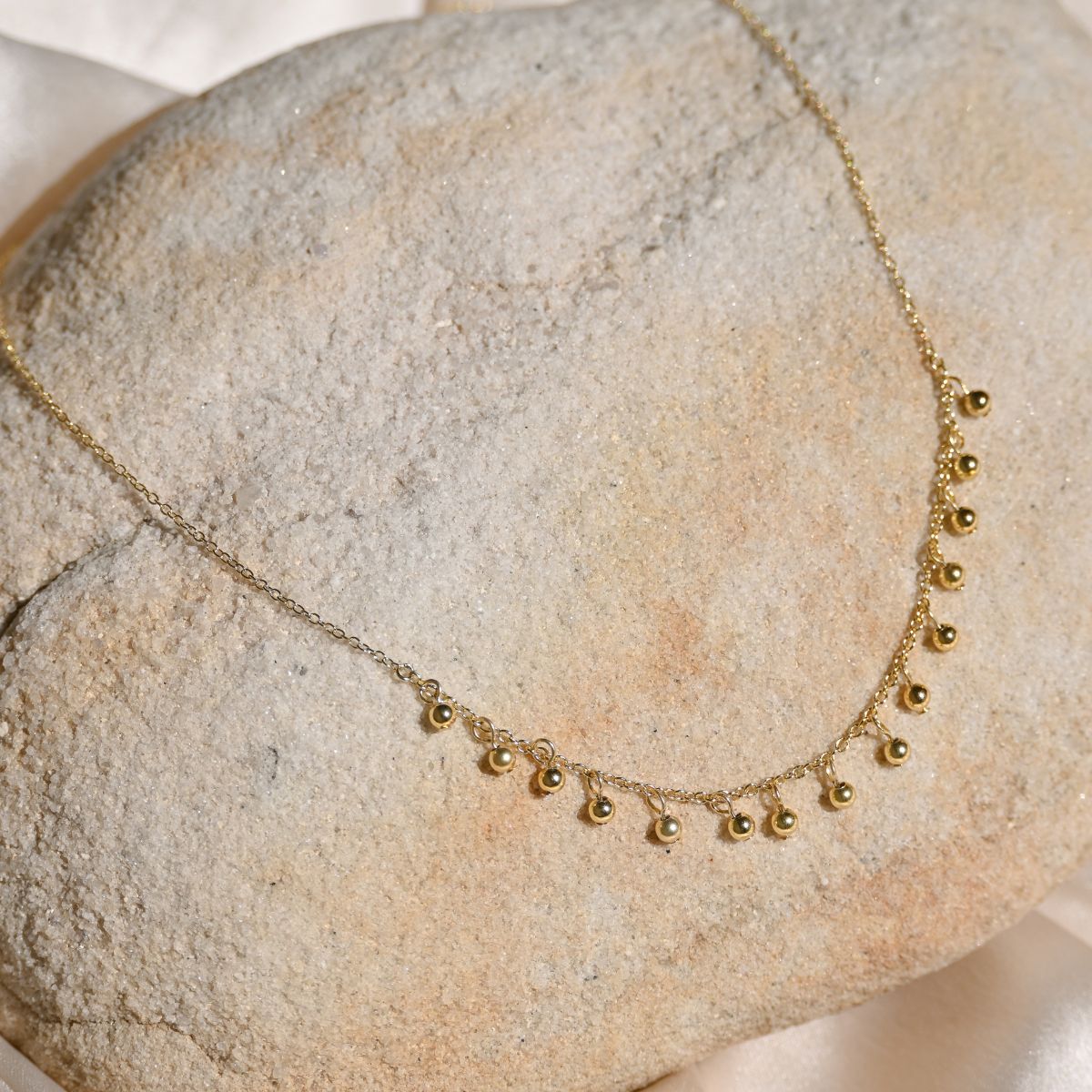 Lots of tiny little balls on chain necklace