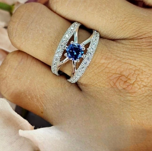 Sterling Silver Ring With Cros Detail And Blue Cubic Zirconia Centre