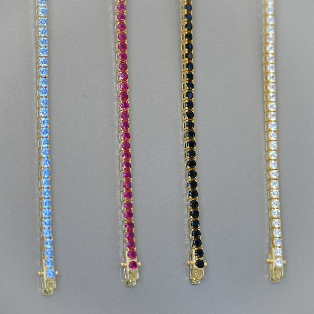 Gold tennis bracelet with clear zirconia stones