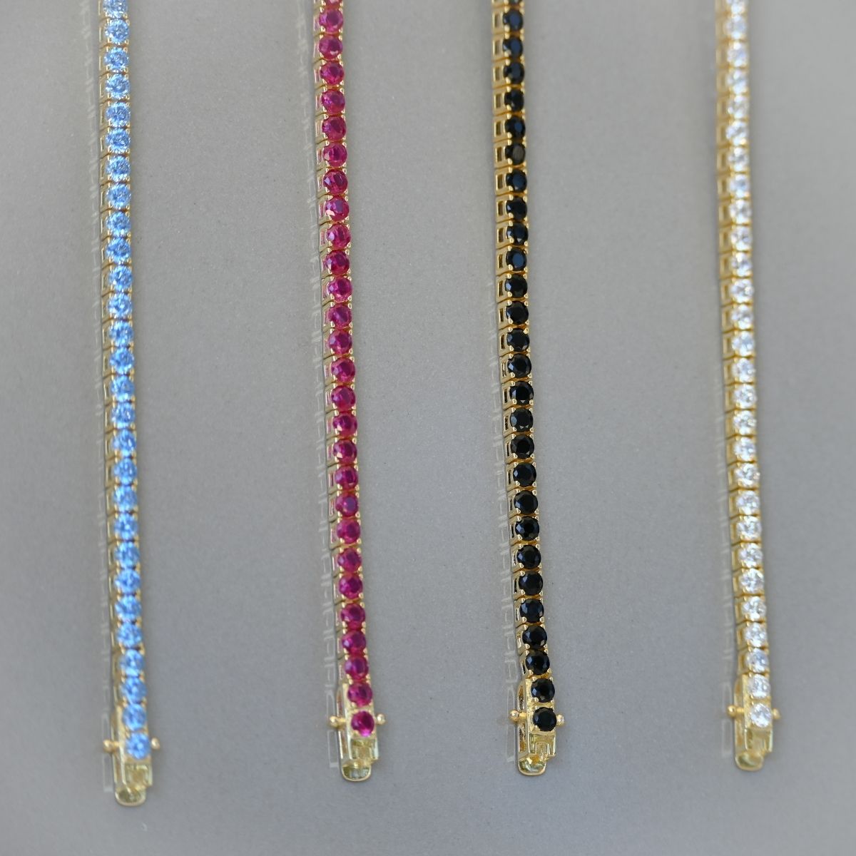 Gold tennis bracelet with clear zirconia stones