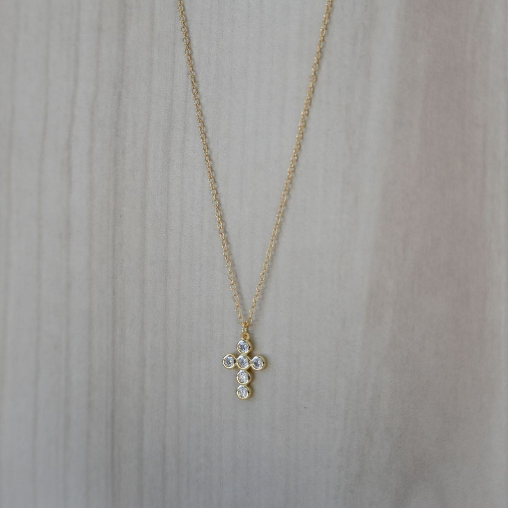 Gold cross necklace with clear zirconia stones