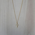 Gold cross necklace with clear zirconia stones