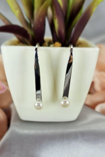 Modern silver bar earrings with freshwater pearl on end