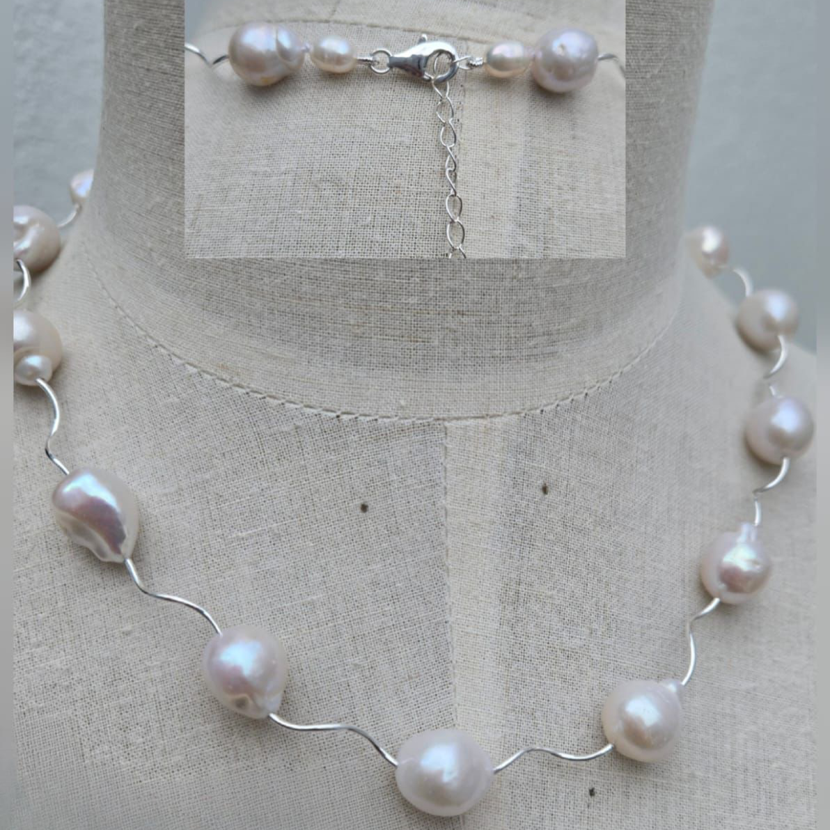 Pearl necklace on a mannequin with a close-up of the necklace in the background.