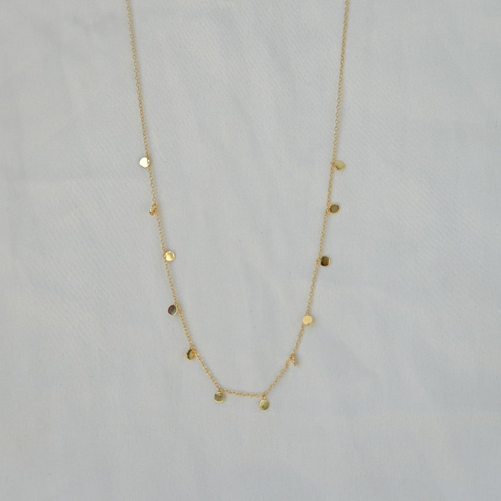 Dangly dot gold necklace