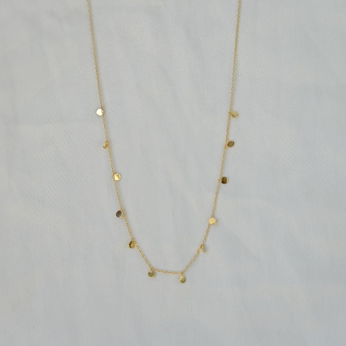Dangly dot gold necklace