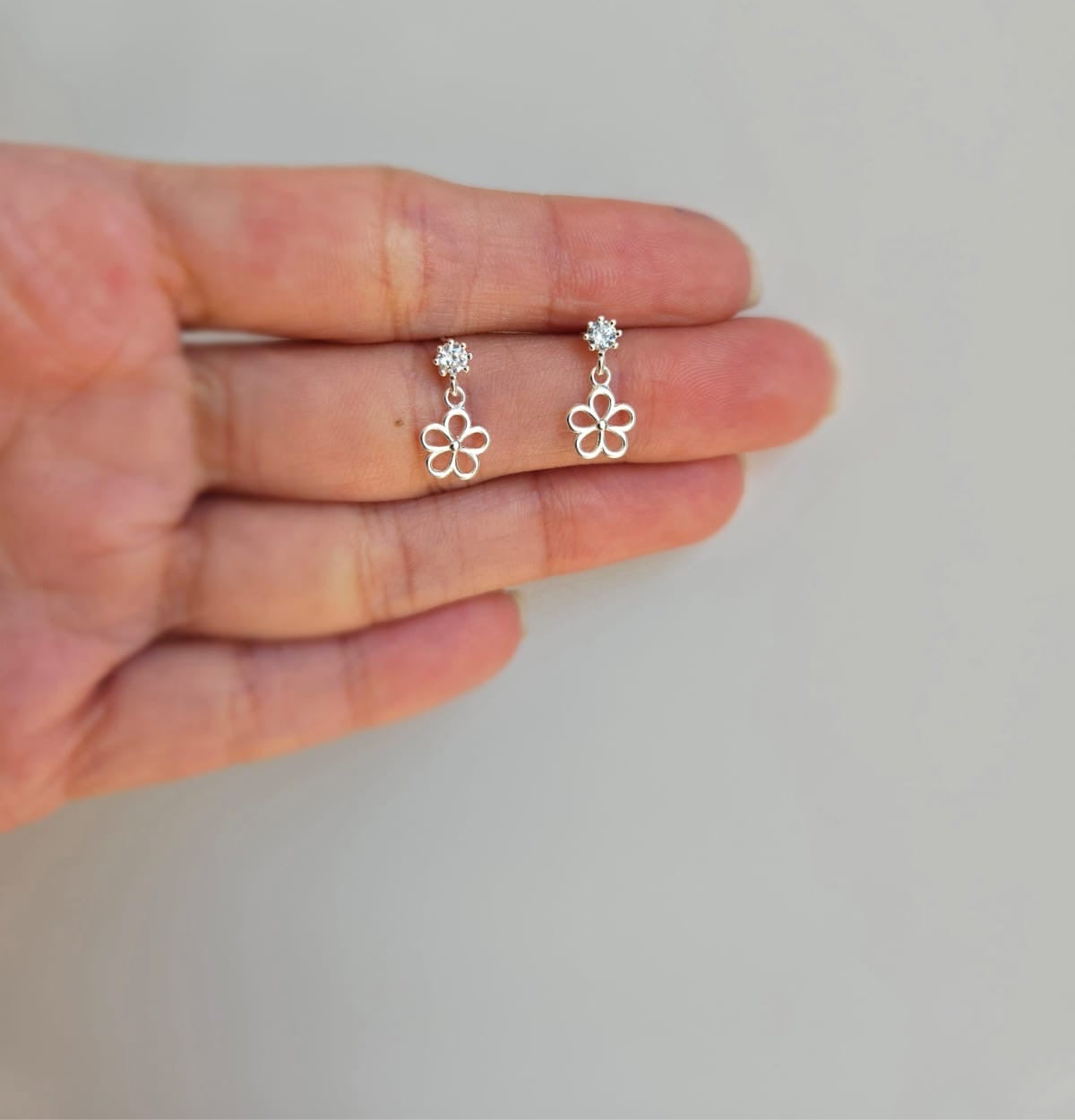 Flower drop studs on cubic zirconia stud