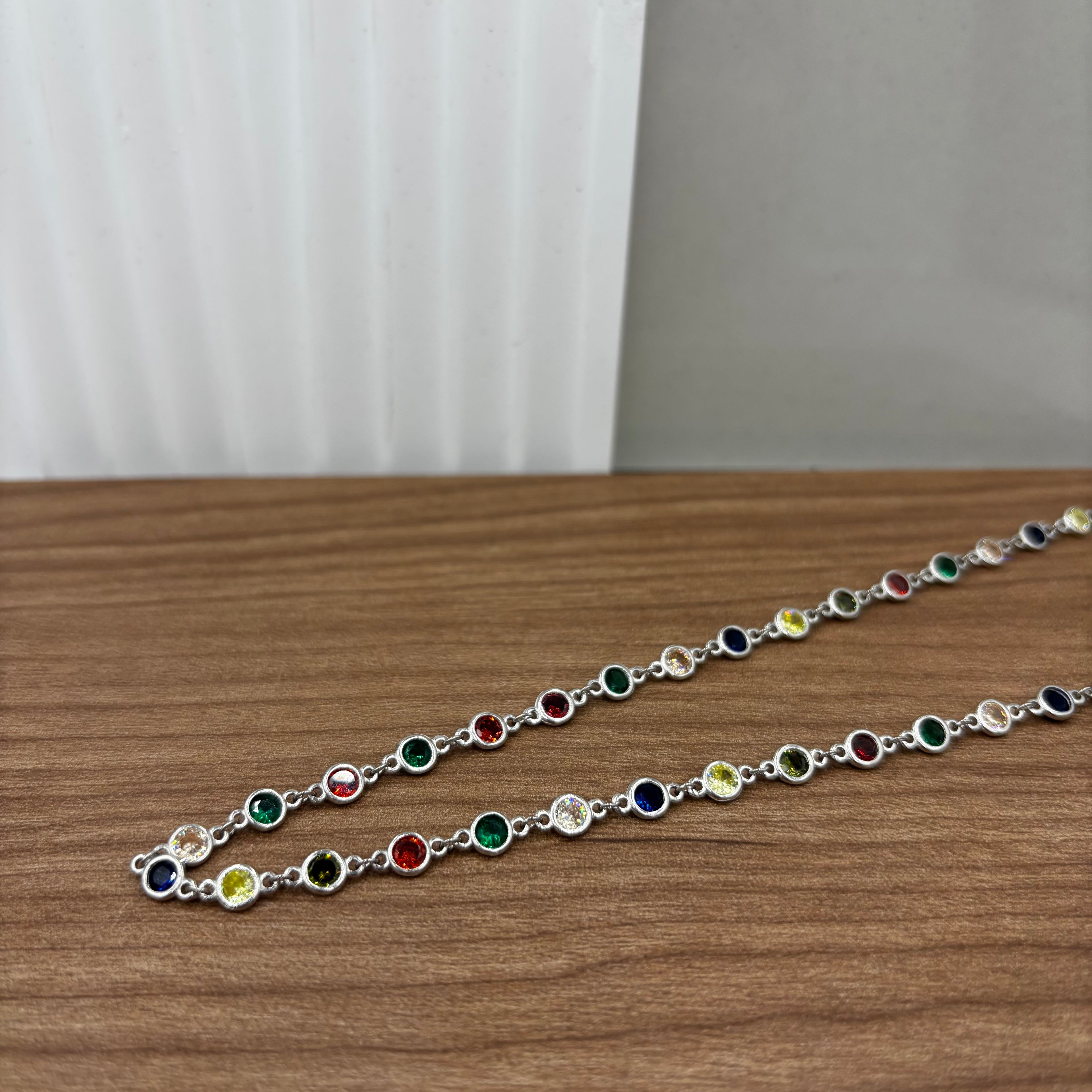 Sterling silver necklace with different coloured stones in chain