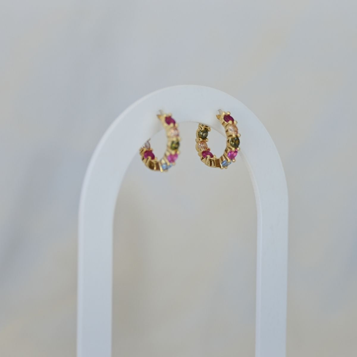 Five coloured zirconia gold huggy earrings