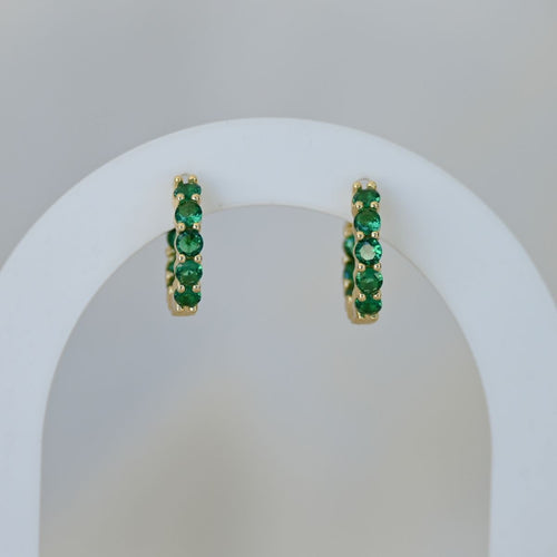 Gold Huggys with green zirconia stones