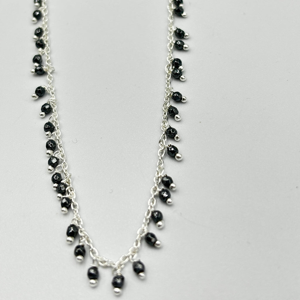 Sterling Silver Necklace With Lots Of Hematite Semi Precious Stones Dangling On It