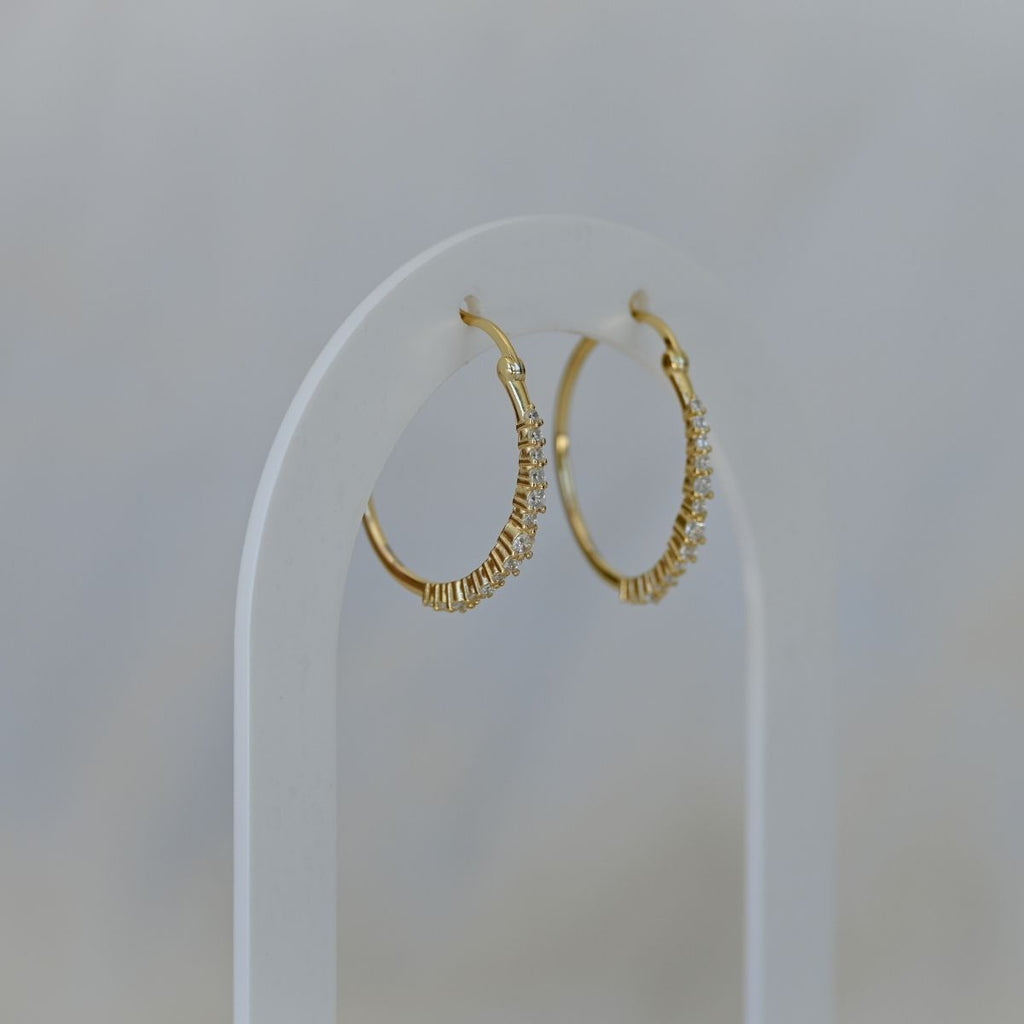 Gold hoop earrings with clear zirconia stones