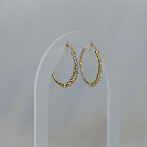 Gold hoop earrings with clear zirconia stones