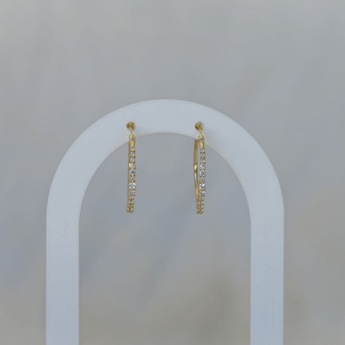 Gold hoop earrings with clear zirconia stones