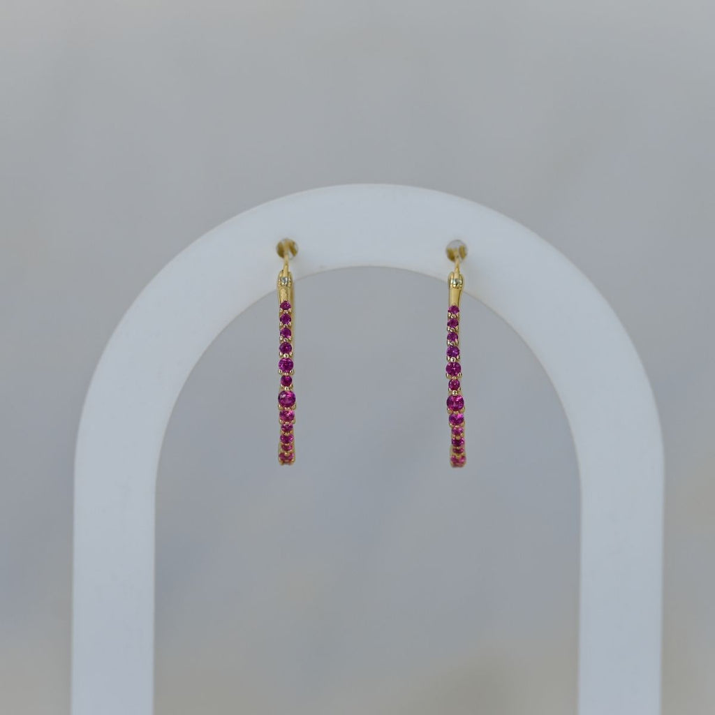 Gold hoops with ruby zirconia stones