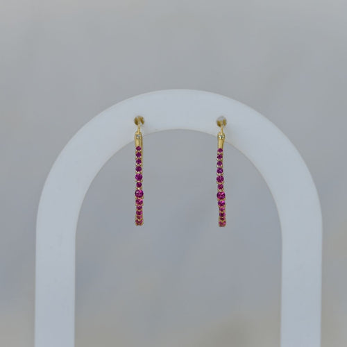 Gold hoops with ruby zirconia stones