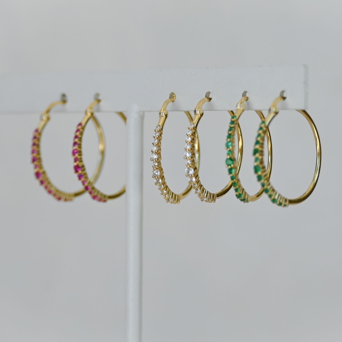 Gold hoop earrings with clear zirconia stones