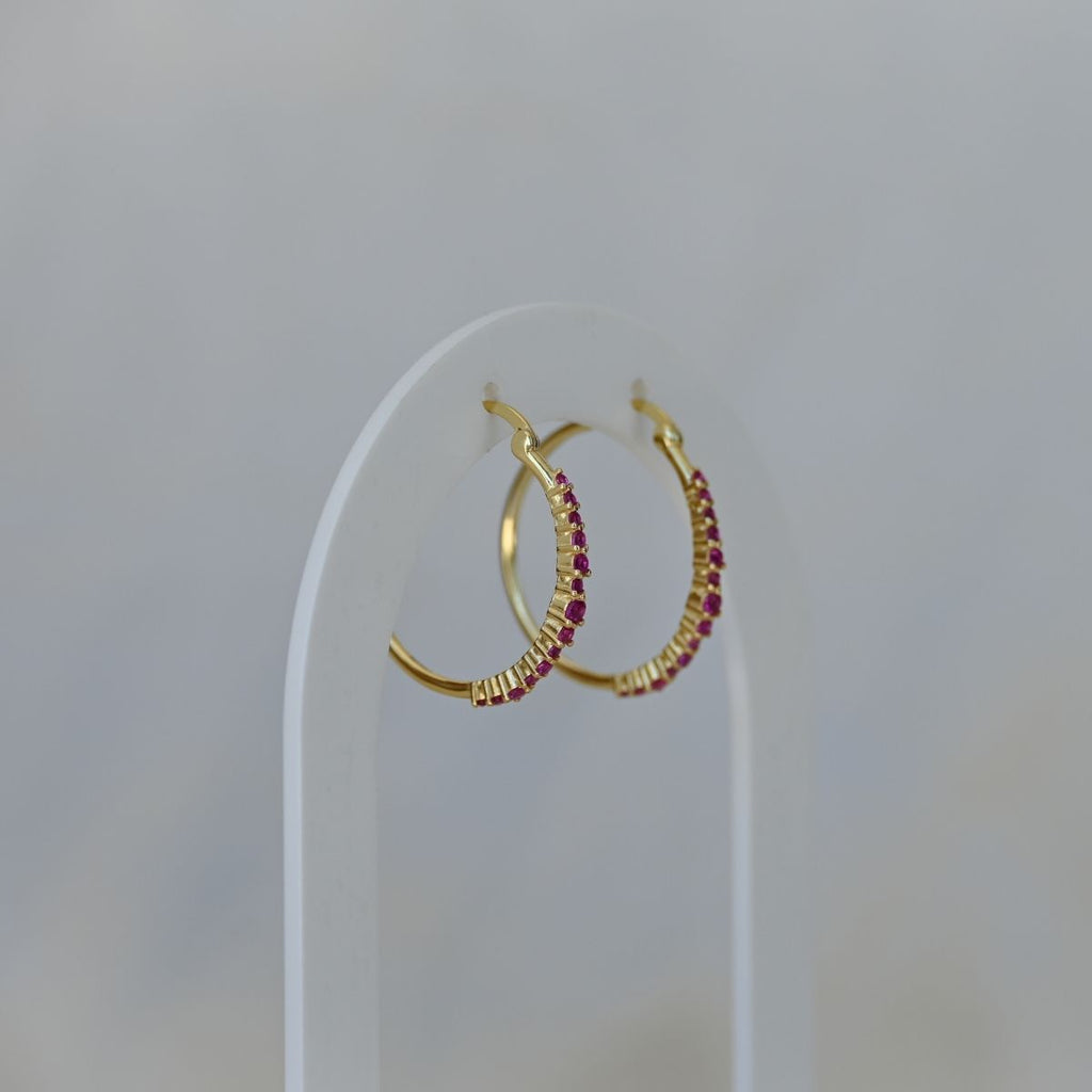 Gold hoops with ruby zirconia stones