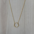 Gold necklace with clear zirconia circle