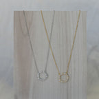 Gold necklace with clear zirconia circle
