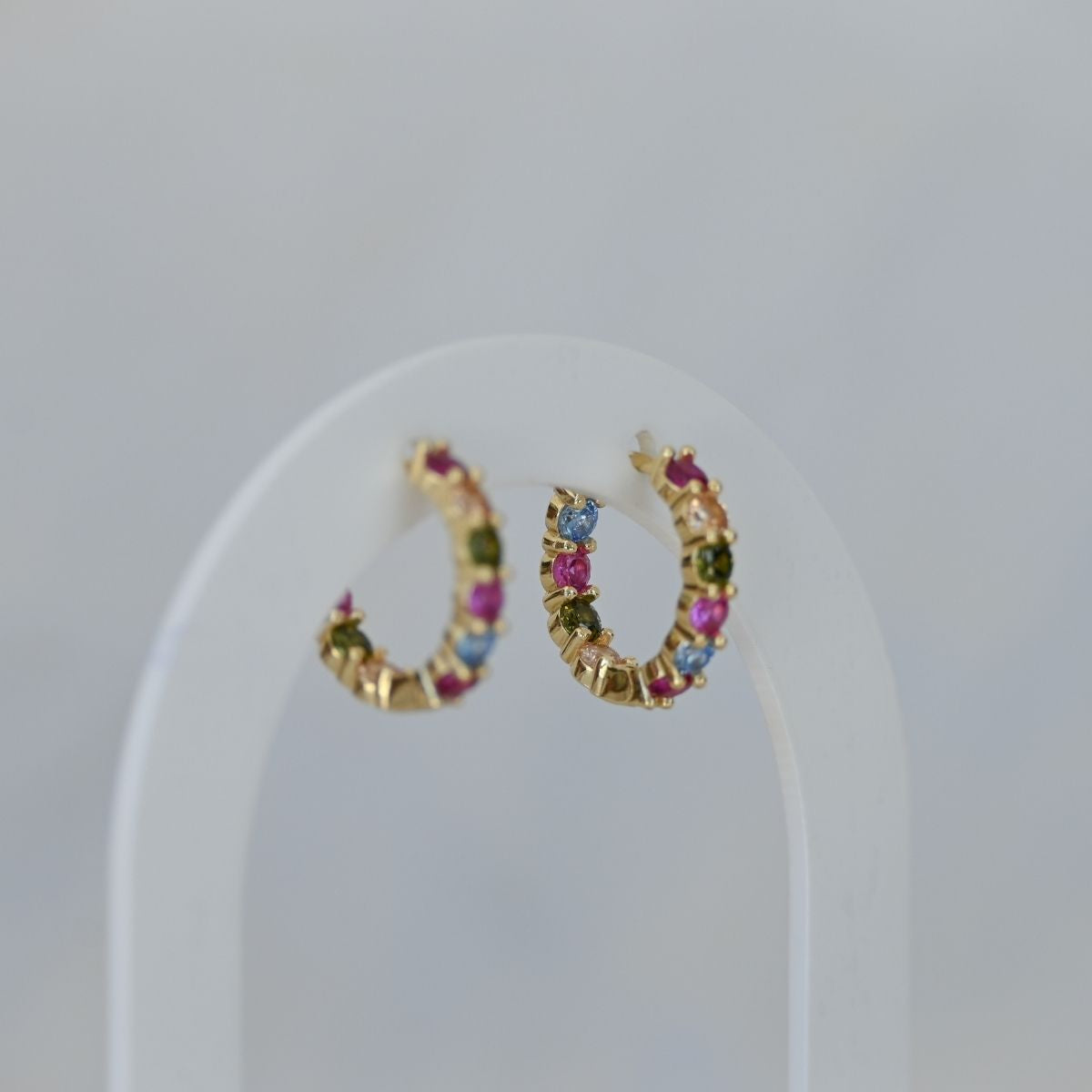 Five coloured zirconia gold huggy earrings