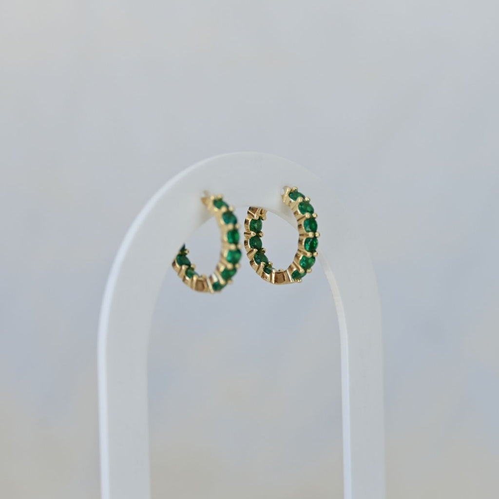 Gold Huggys with green zirconia stones