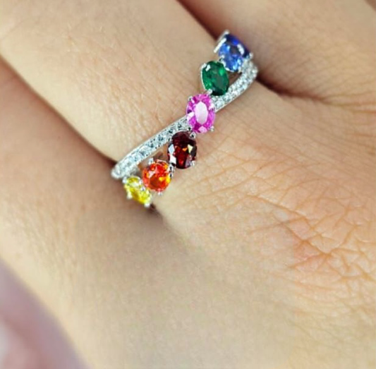 Soft looking cross over rainbow ring