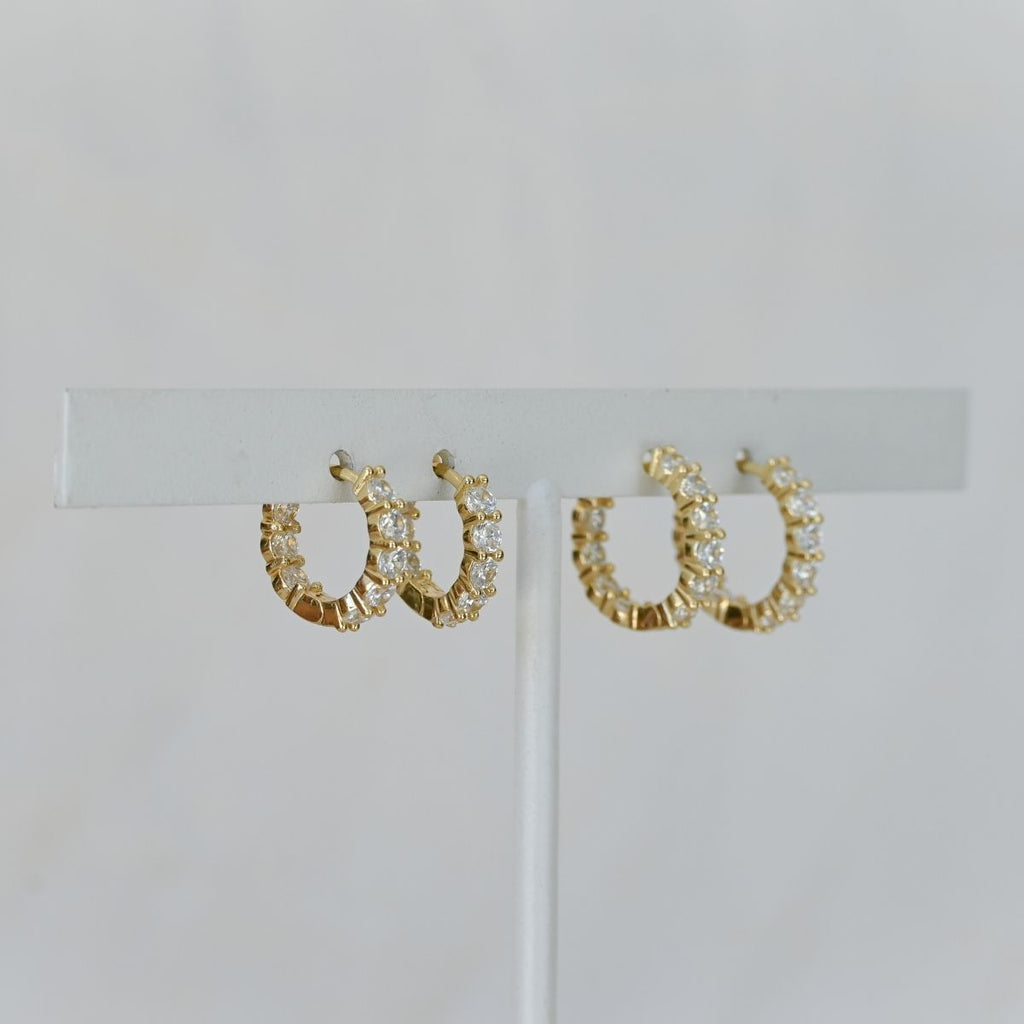 Gold huggy earrings with clear zirconia stones