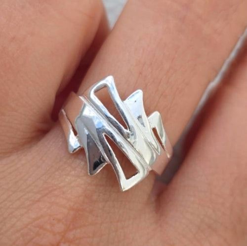 Silver ring on a person's finger