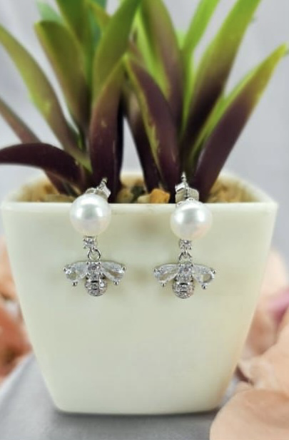 Freshwater pearl earrings with cubic zirconia dangling bee