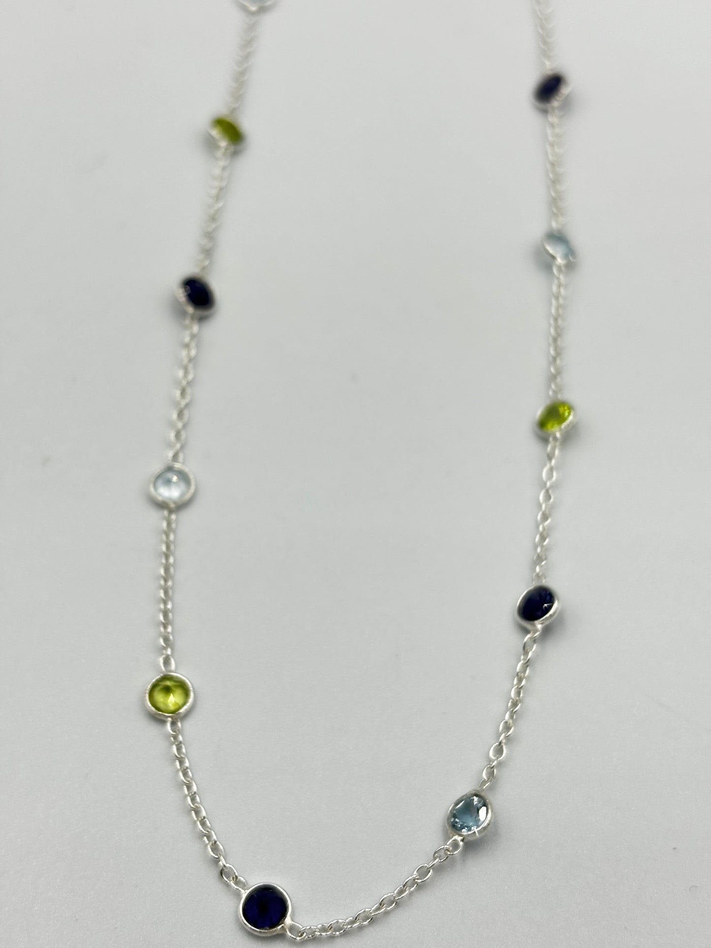 Sterling silver necklace with 5mm Peridot, Blue Topaz and Iol semi precious stones in-bedded in necklace
