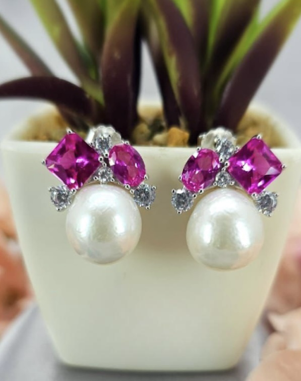 Beautiful pearl earrings with pink cubic zirconia on top