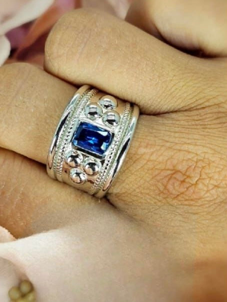 Sterling silver ring with rectangular blue cubic zirconia