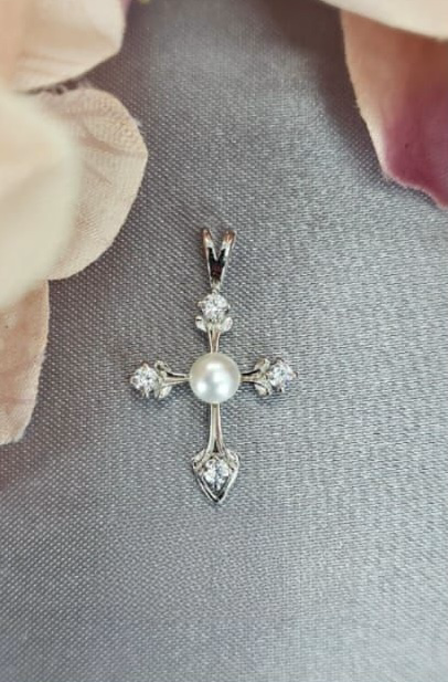 Sterling silver cross pendant with cubic zirconia on end