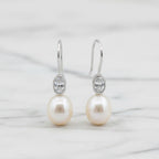 Elegant Freshwater Pearl Drops With Oval Cubic In Tube Earrings