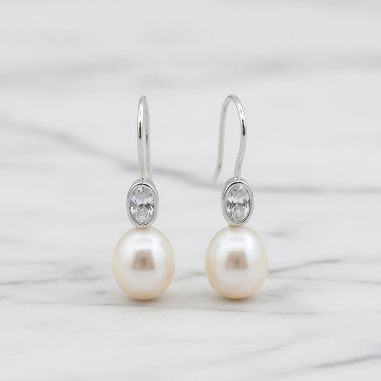 Elegant Freshwater Pearl Drops With Oval Cubic In Tube Earrings