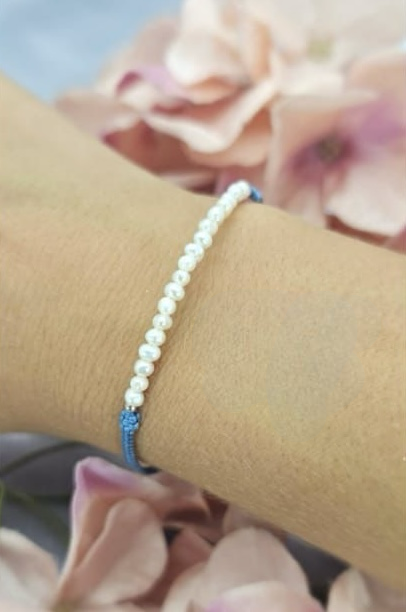 Beautiful tiny freshwater pearls on adjustable blue modern cord