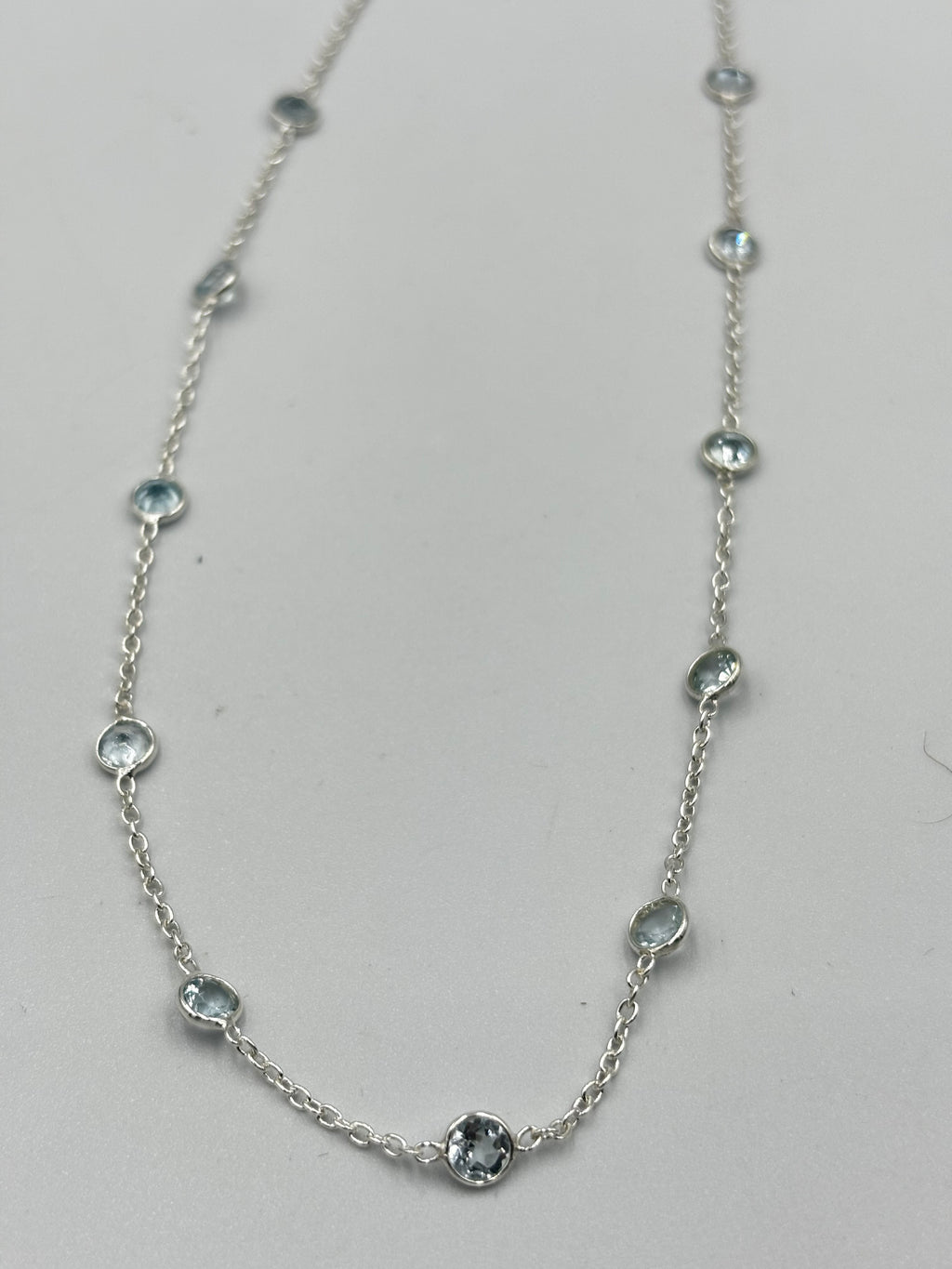 Sterling Silver Necklace With 5Mm Blue Topaz Semi Precious Stones In-Bedded In Necklace