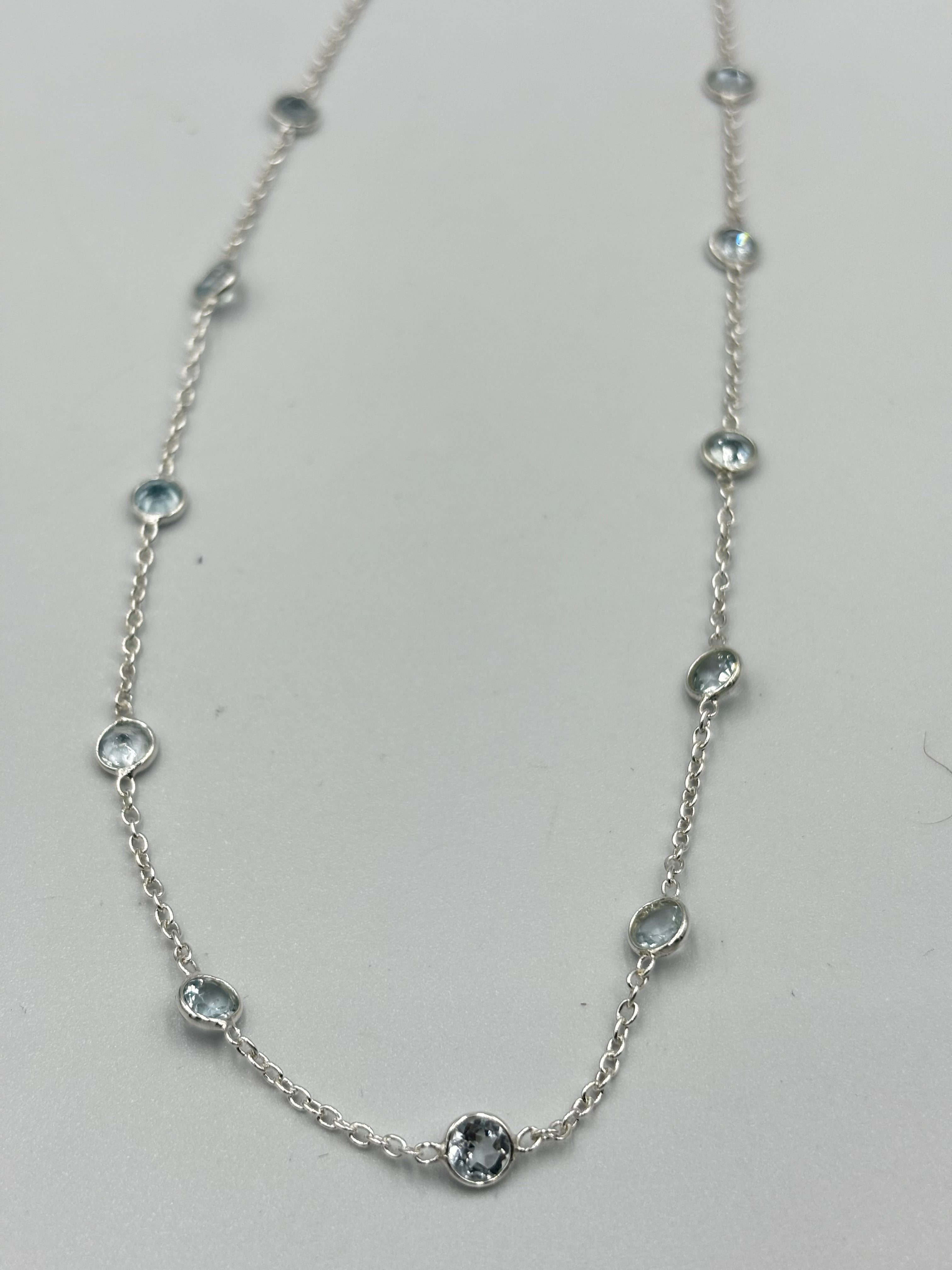 Sterling Silver Necklace With 5Mm Blue Topaz Semi Precious Stones In-Bedded In Necklace