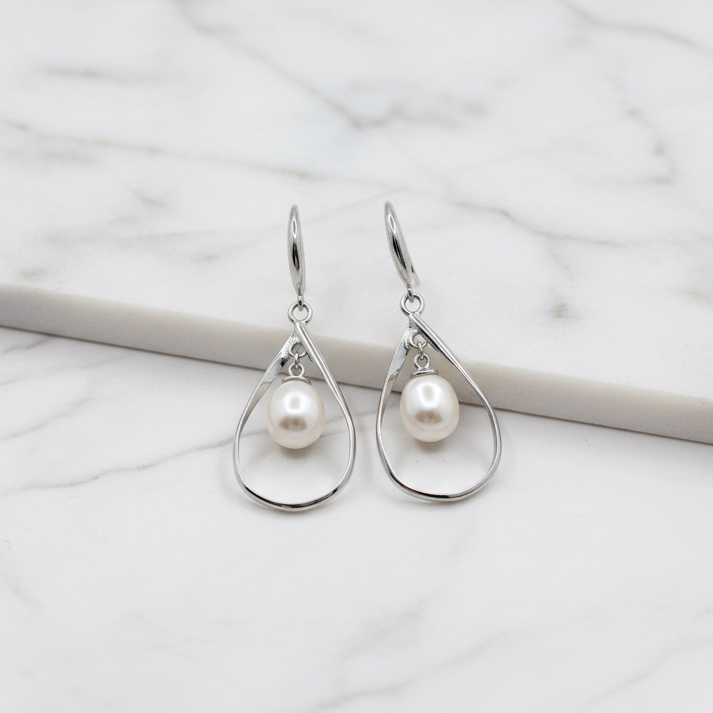 Drop Earrings With Beautiful Freshwater Pearl Hanging In Oval