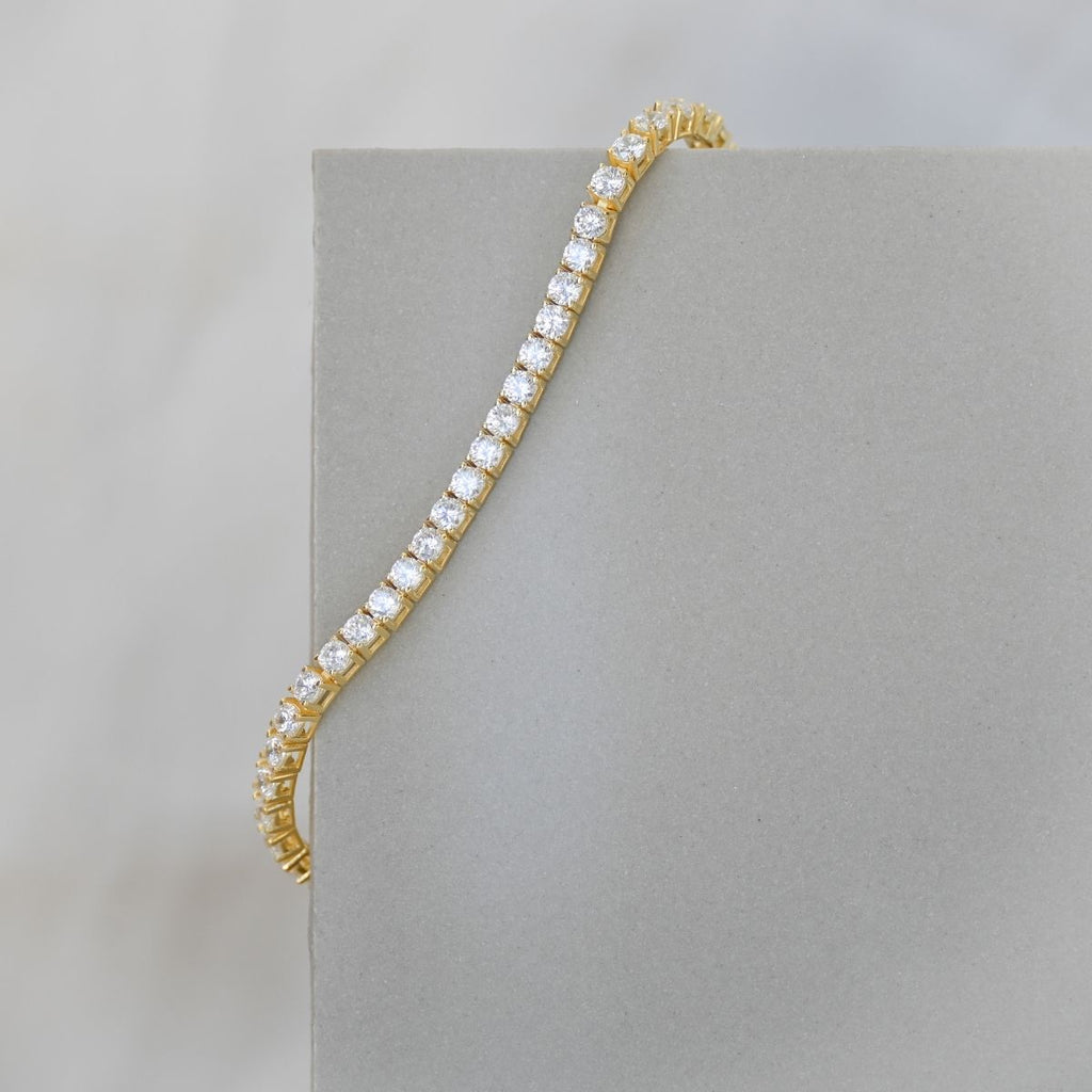 Gold tennis bracelet with clear zirconia stones