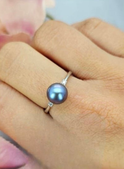 Adjustable ring with blue freshwater pearl and cubic zirconia detail