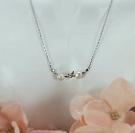 Beautiful necklace with bird on branch and freshwater pearls