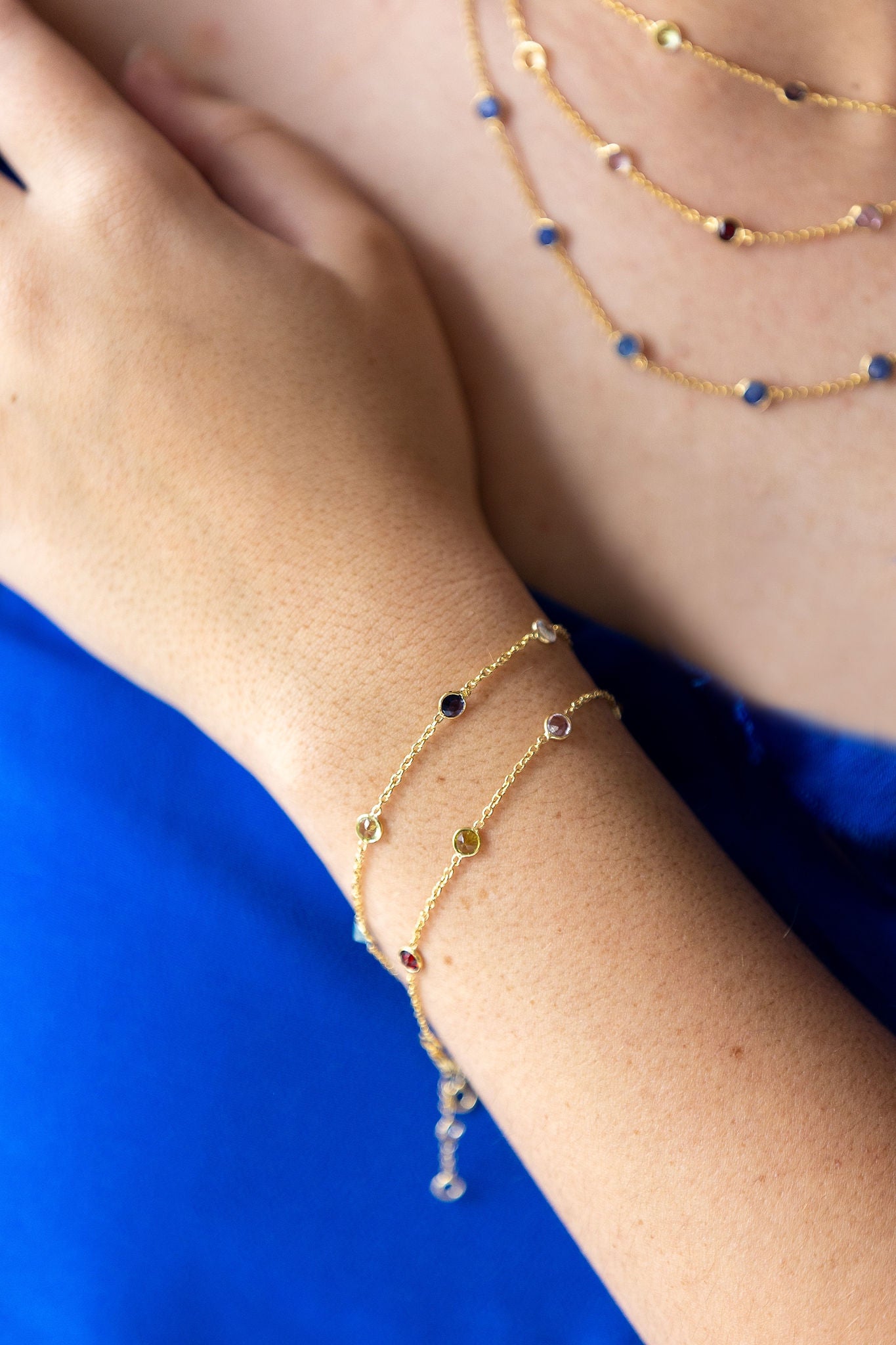 Stunning gold bracelet with shades of blue semi precious stones inbedded in chain