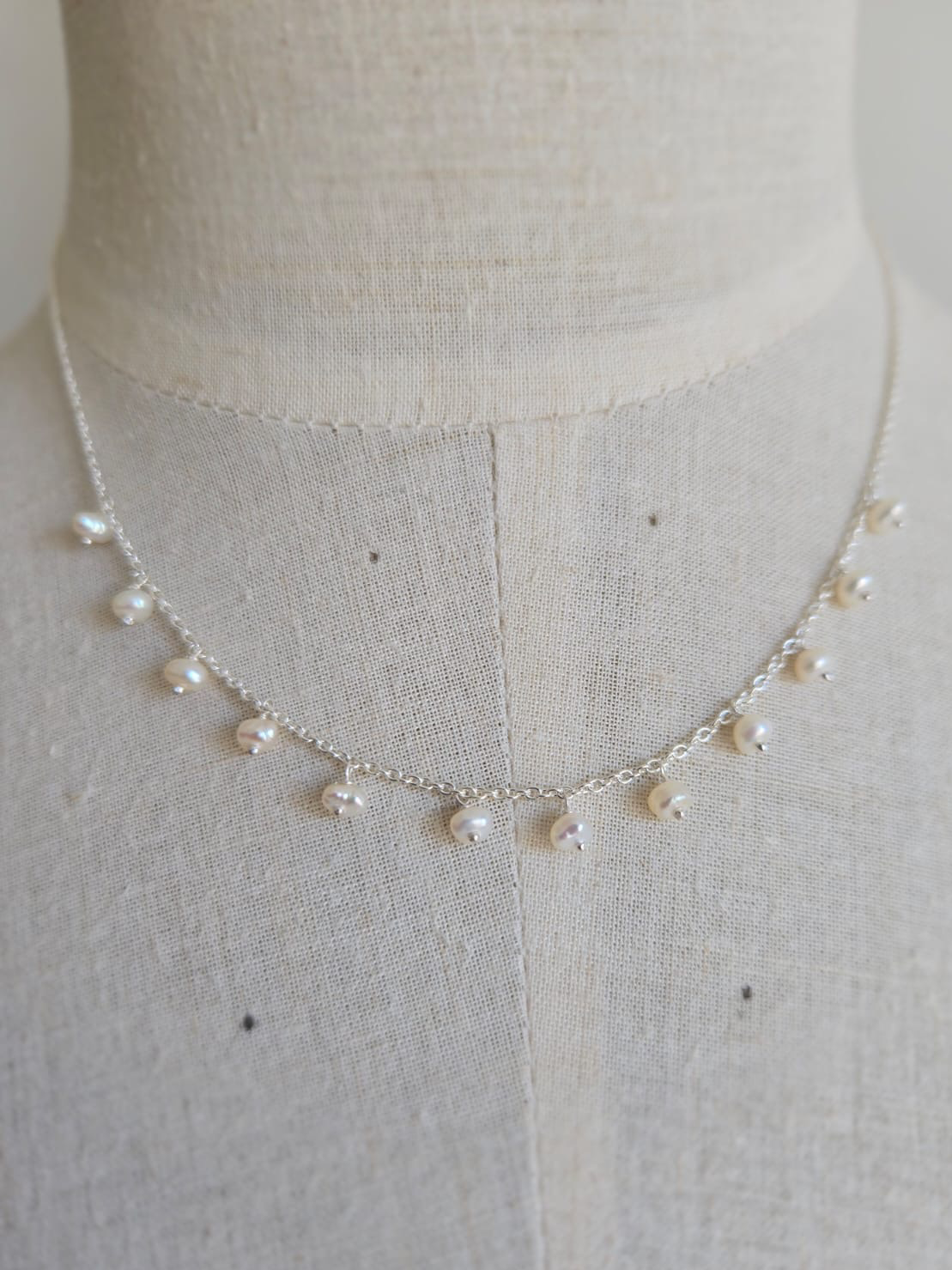 Sterling silver necklace with lots of dangling freshwater pearls